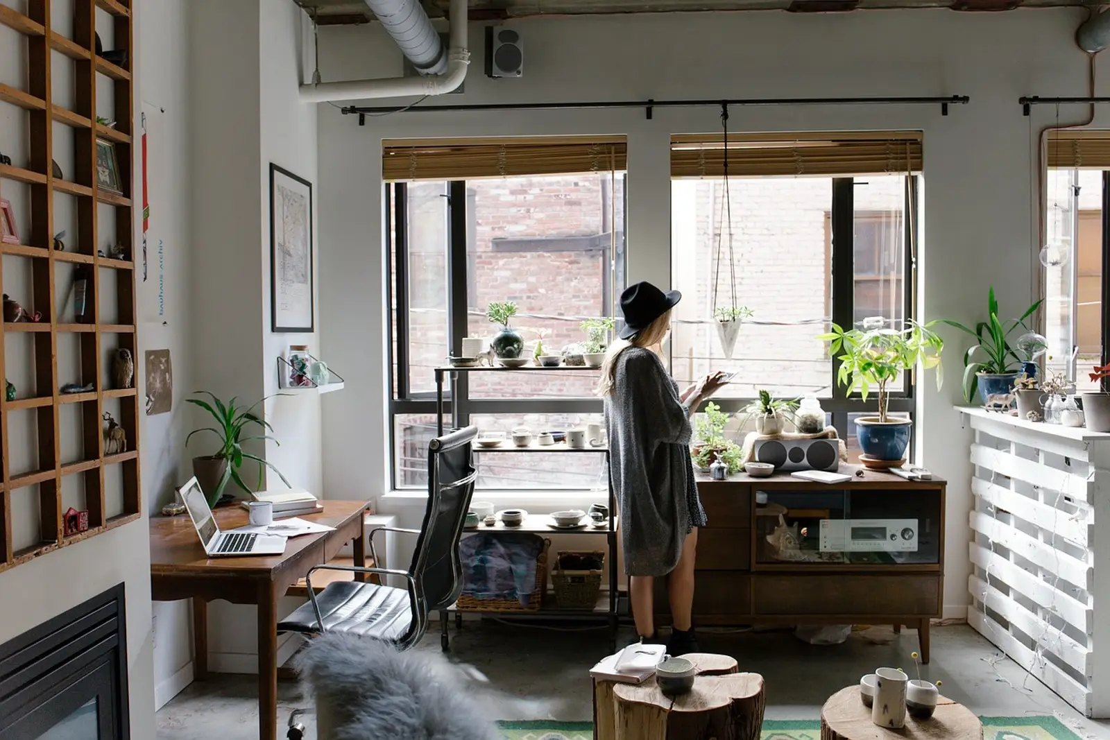 Woman in her home office calmly reaching for her jacket, learning how to stop being indecisive
