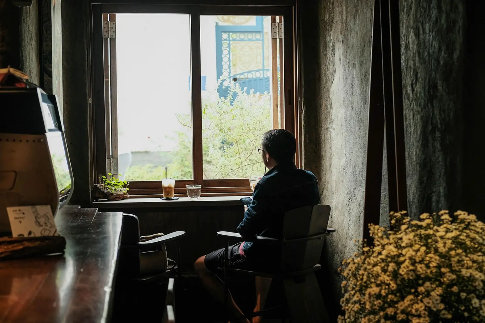 Business owner sitting calmly on the edge of the bed in the morning, learning how to switch off from work